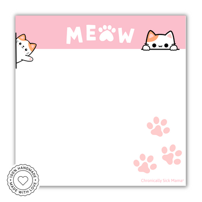 Notepad with cat-themed design, 'MEOW' text, and paw prints on a pink background.