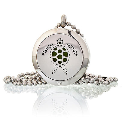 Silver pendant with turtle design on a white background